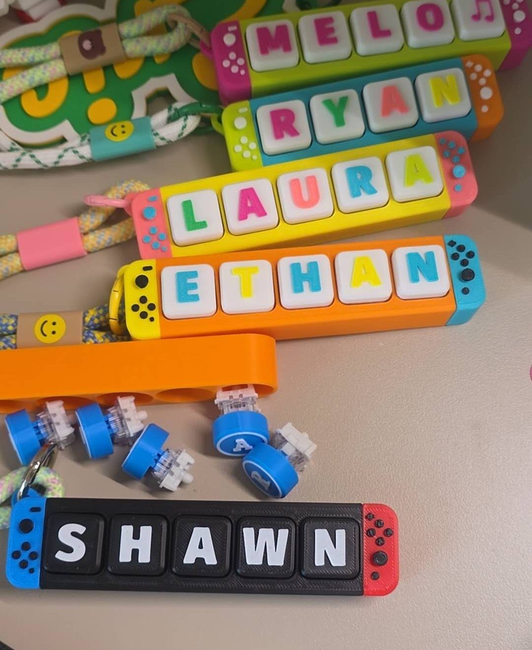 A group of colourful personalised name bar concepts